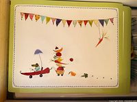 Stack of illustrated vinyl placemats
