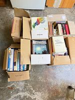 Six boxes filled with assorted books and magazines
