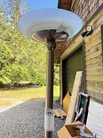 Full view of brushed nickel torchiere lamp with frosted glass shade