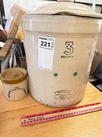 Medalta crock with lid beside Stilton cheese jar, ruler for scale
