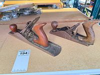 Both bench planes side-by-side on tabletop showing size difference and overall condition