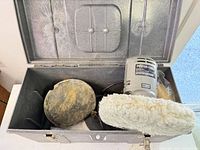 Open metal toolbox showing Porter-Cable 304 sander, wool pad, other accessories