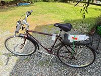 Full left-side view of bicycle showing frame, wheels, rack, fenders and accessories