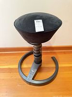 Full view of Swopper stool showing seat, spring column and base
