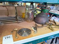 Group shot showing rack rods, mason jar, teapot, saw blade, brass hook, decorative pulls and fasteners