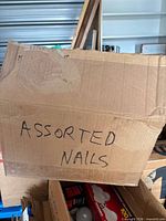 Exterior of cardboard box marked Assorted Nails