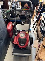 Front view of Briggs & Stratton pressure washer showing control panel labeled 2550 PSI Elite Series