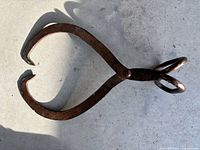 Full view of cast iron ice block tongs