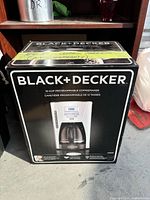 Front of boxed Black+Decker coffeemaker