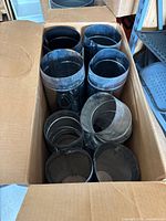 Box containing multiple round duct pipes and fittings