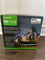 Front of retail box showing product details and model