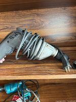 Side view of Craftsman corded drill with cord wrapped around body