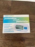 Front of retail box showing WeightWatchers PointsPlus pedometer branding and features