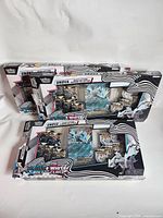 Front view of both Pokémon Unova Black Bolt & White Flare boxes showing packaging and interior booster packs