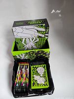 Open Perfect Order ETB showing booster packs, card sleeves, dice, internal tray, outer box