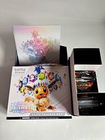 Front and lid of Elite Trainer Box displaying Eevee prismatic artwork