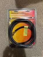 Front of sealed package showing 10' Buddy Series Propane Hose Assembly