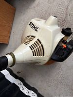 Stihl engine housing with logo and controls