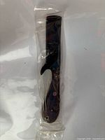 Knife sealed in plastic