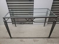 full view of glass top metal table front angle