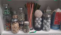 Group of filled jars on shelf