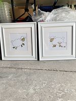 Both framed sheep prints side by side
