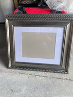 Overall view of one frame showing brushed silver frame, white mat, blank insert