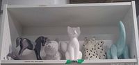 Shelf view showing all five figurines