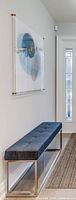 Artwork mounted in hallway showing size and mounting hardware