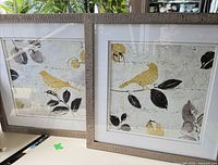 Both framed prints side by side showing artwork and frames