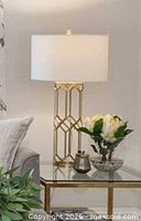Lamp on side table showing full appearance with shade