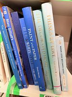 Spines of all eight home décor books on shelf