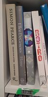Shelf showing five hardcover design and colour books