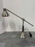 Full view of brushed silver adjustable desk lamp