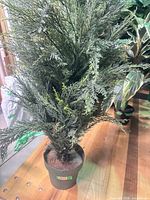 Full view of artificial shrub in pot