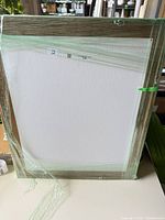 Framed print wrapped in protective film