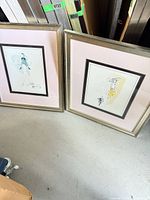 Both framed artworks side by side showing frame style and mats