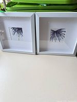 Both framed prints side by side, showing design and frames