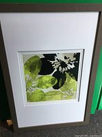 Front view of framed floral print showing artwork, matting and frame