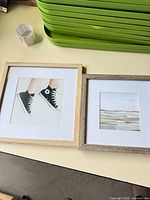 Both framed prints side by side