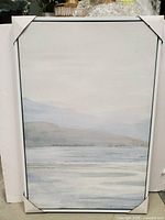 Full view of framed canvas with protective corner covers