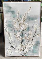 Full view of framed canvas art showing blossom design