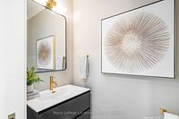 Art hung over vanity showing scale and design