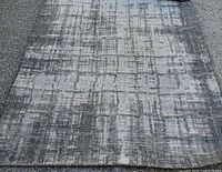 Top view of full rug laid flat on pavement