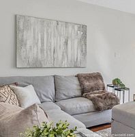 Painting hung above sofa showing overall look