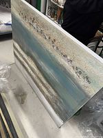 Full view of canvas leaning against surface