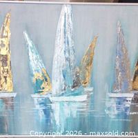 Close view of sailboat motif showing mixed metal textures