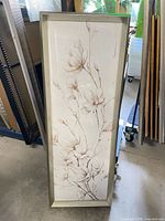 Full view of framed magnolia artwork standing vertically