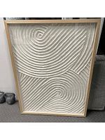 Front view of paper swirl relief artwork showing full design and light wood frame