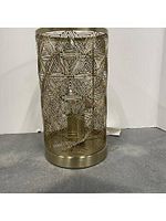 Front view of one gold metal cylindrical lamp